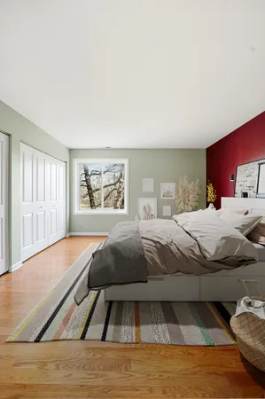 a bedroom with a large bed and a couch