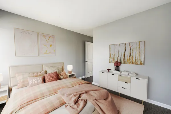 a bedroom with a bed and a white cabinet