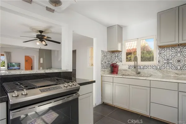 a kitchen with a stove and a sink