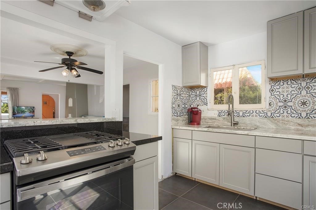 251 Avenida Del Mar, Unit A San Clemente, CA 92672 - Photo 3 of 15 a kitchen with a stove and a sink