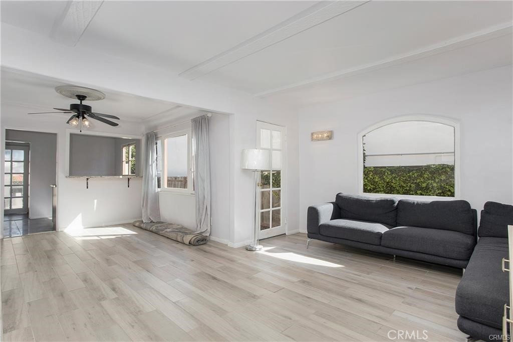 251 Avenida Del Mar, Unit A San Clemente, CA 92672 - Photo 10 of 15 a living room with furniture and wooden floor