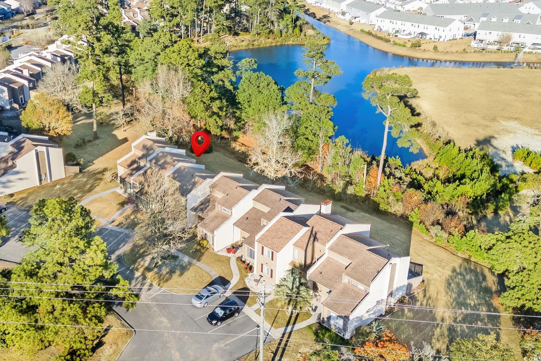 500 Eagle Way, Unit 6 Little River, SC 29566 - Photo 2 of 38 Aerial perspective of suburban area featuring a nearby body of water