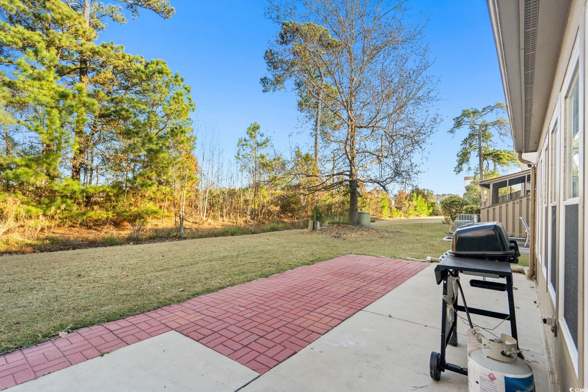 500 Eagle Way, Unit 6 Little River, SC 29566 - Photo 23 of 38 View of patio / terrace featuring a grill