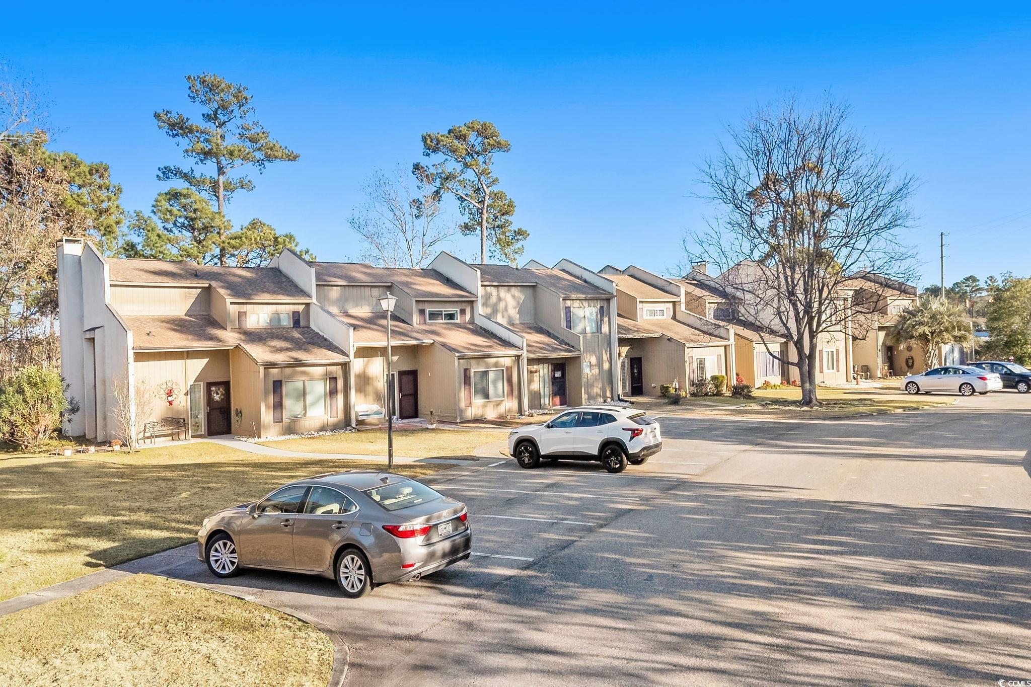 500 Eagle Way, Unit 6 Little River, SC 29566 - Photo 27 of 38 View of asphalt street with a residential view and street lighting