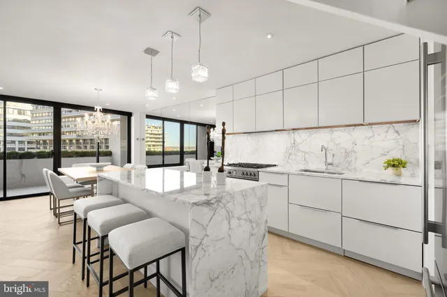 a kitchen with a table and chairs in it