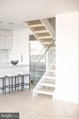 a bedroom with a bed and a lamp