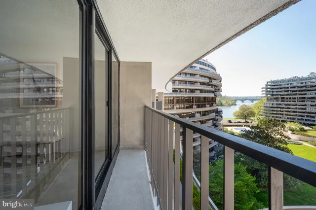 a view of a building with mountains in the background