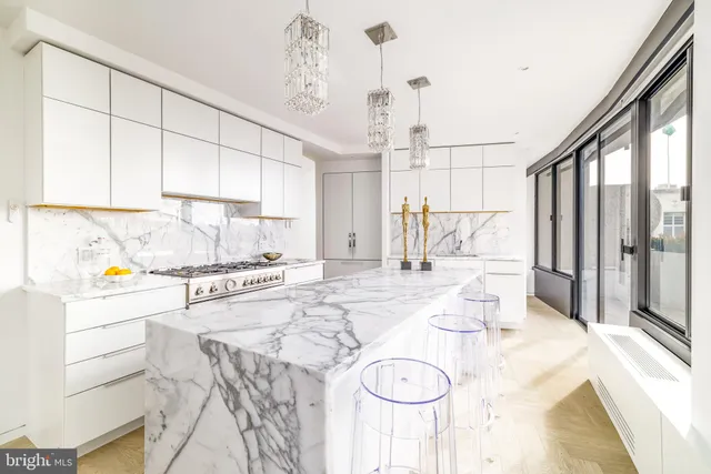 a kitchen with a refrigerator a stove a sink dishwasher and white cabinets with wooden floor