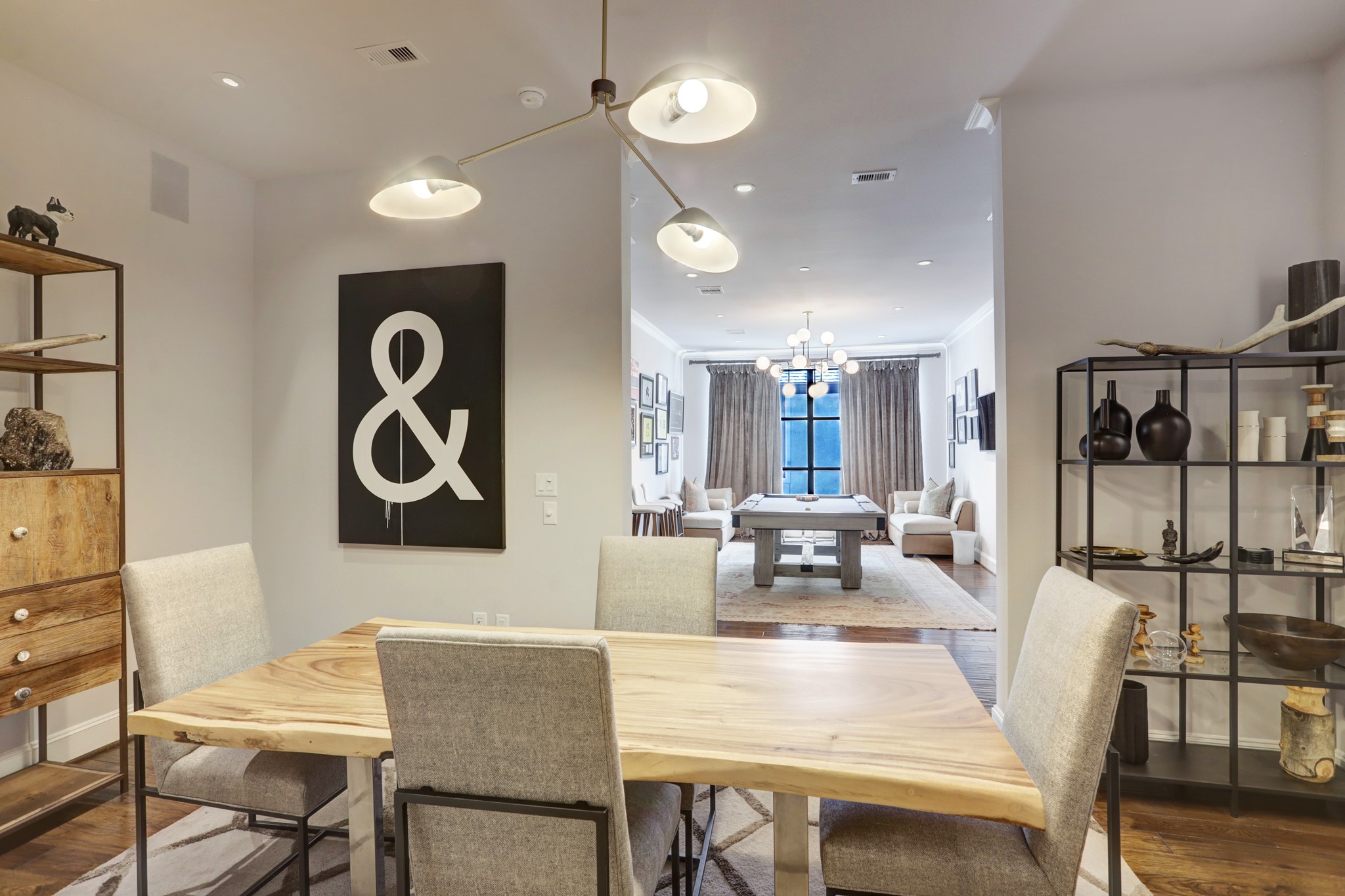 2221 Welch Street, Unit 201 Houston, TX 77019 - Photo 5 of 26 A view from the dining room into the game room.