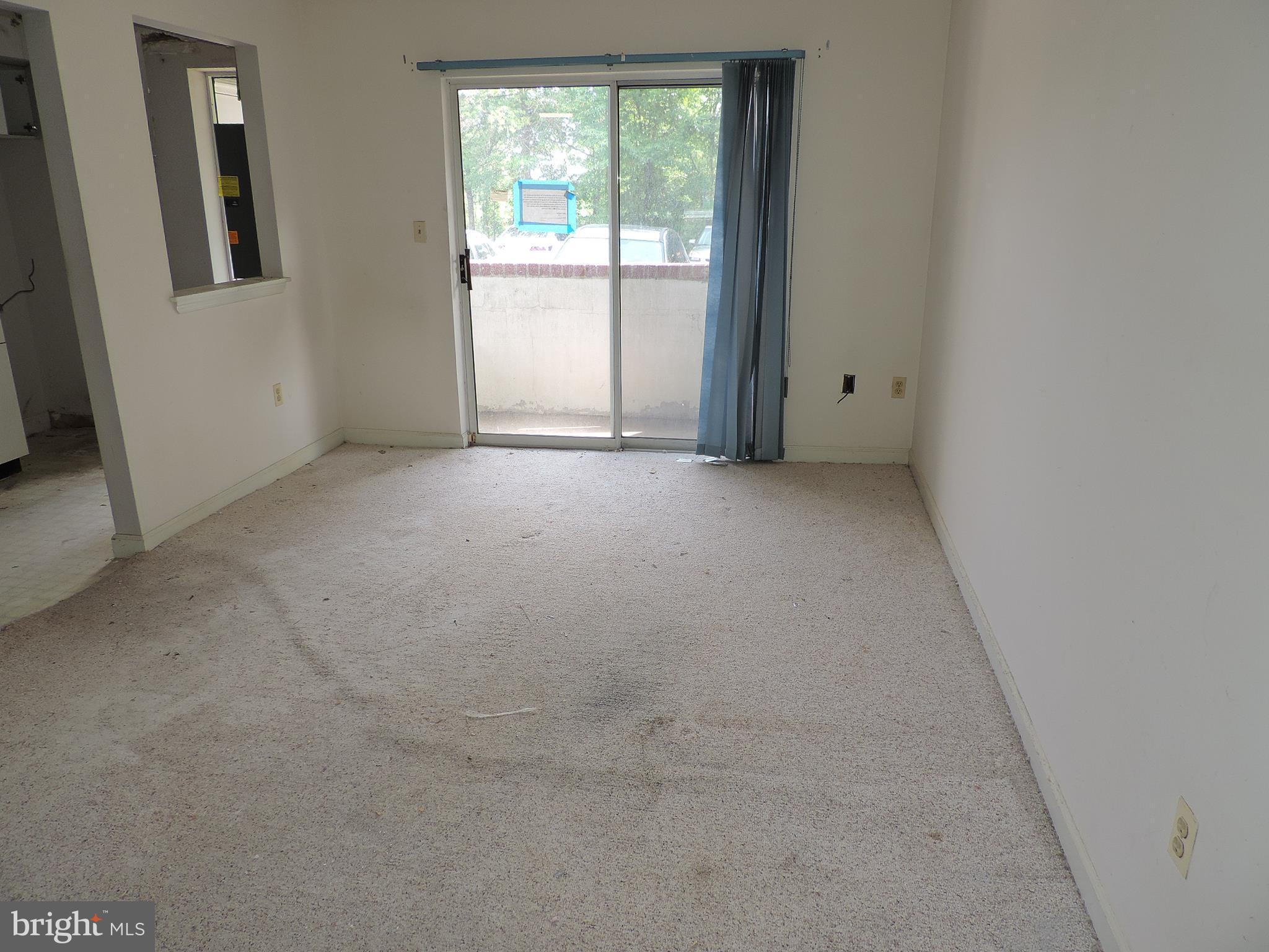 6708 Ridge Road, Unit 104 Baltimore, MD 21237 - Photo 4 of 11 an empty room with windows