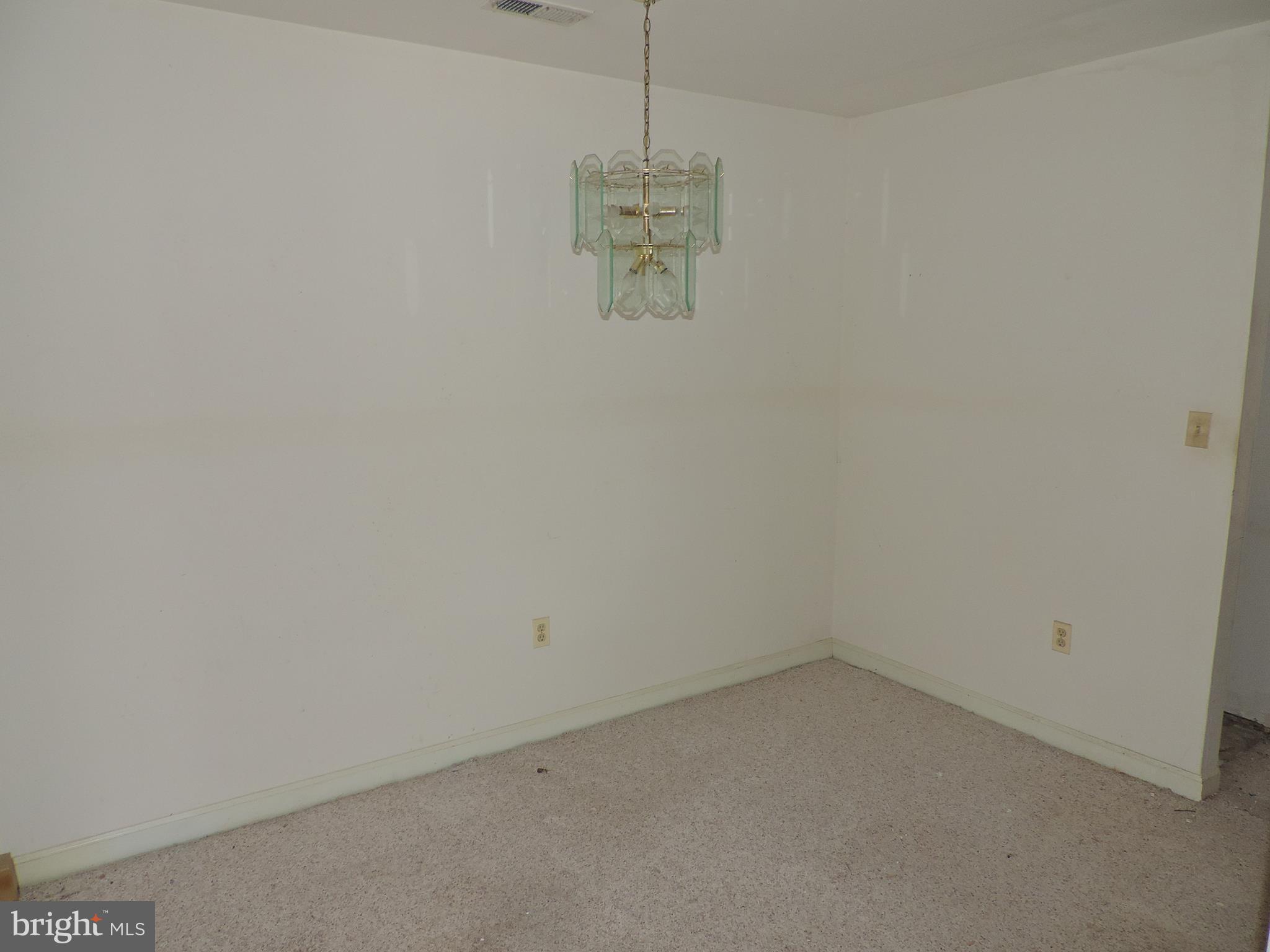 6708 Ridge Road, Unit 104 Baltimore, MD 21237 - Photo 5 of 11 a view of a room with a fan