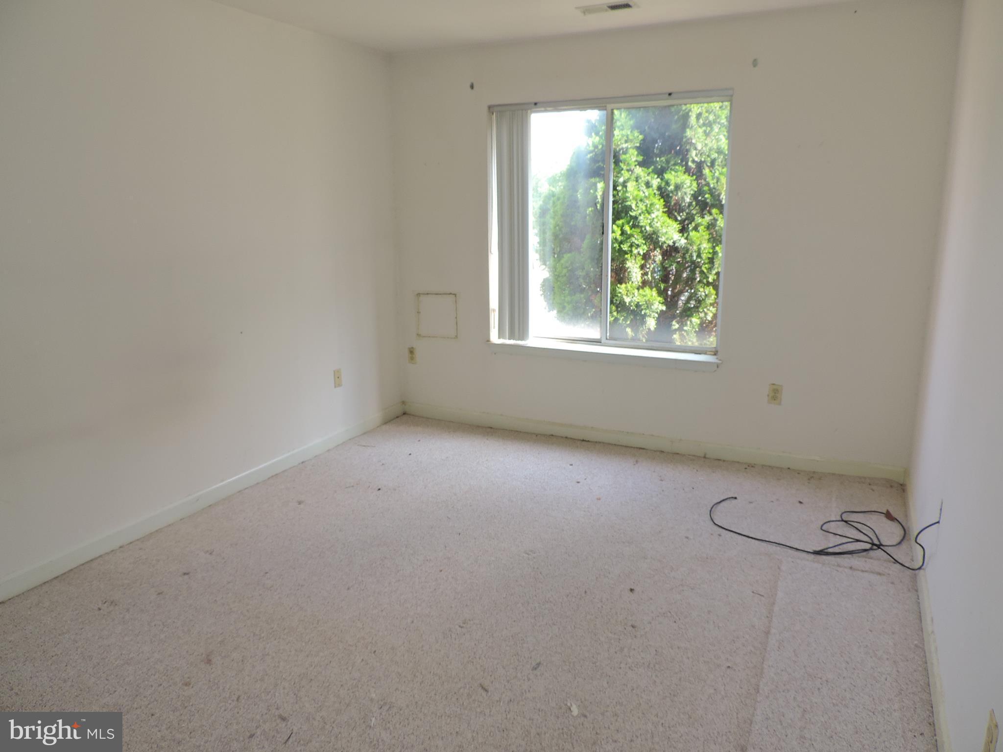 6708 Ridge Road, Unit 104 Baltimore, MD 21237 - Photo 8 of 11 an empty room with a window