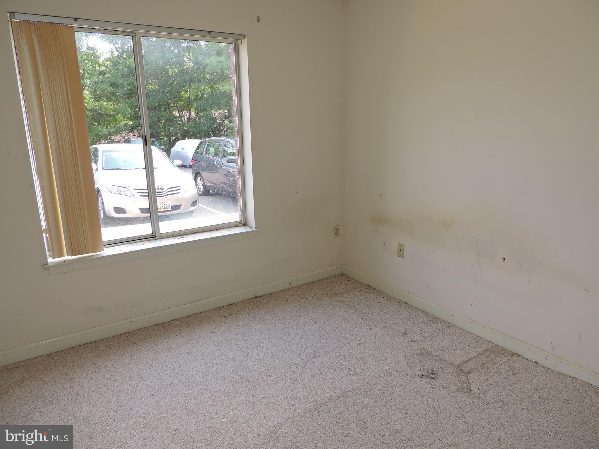 6708 Ridge Road, Unit 104 Baltimore, MD 21237 - Photo 9 of 11 an empty room with a window