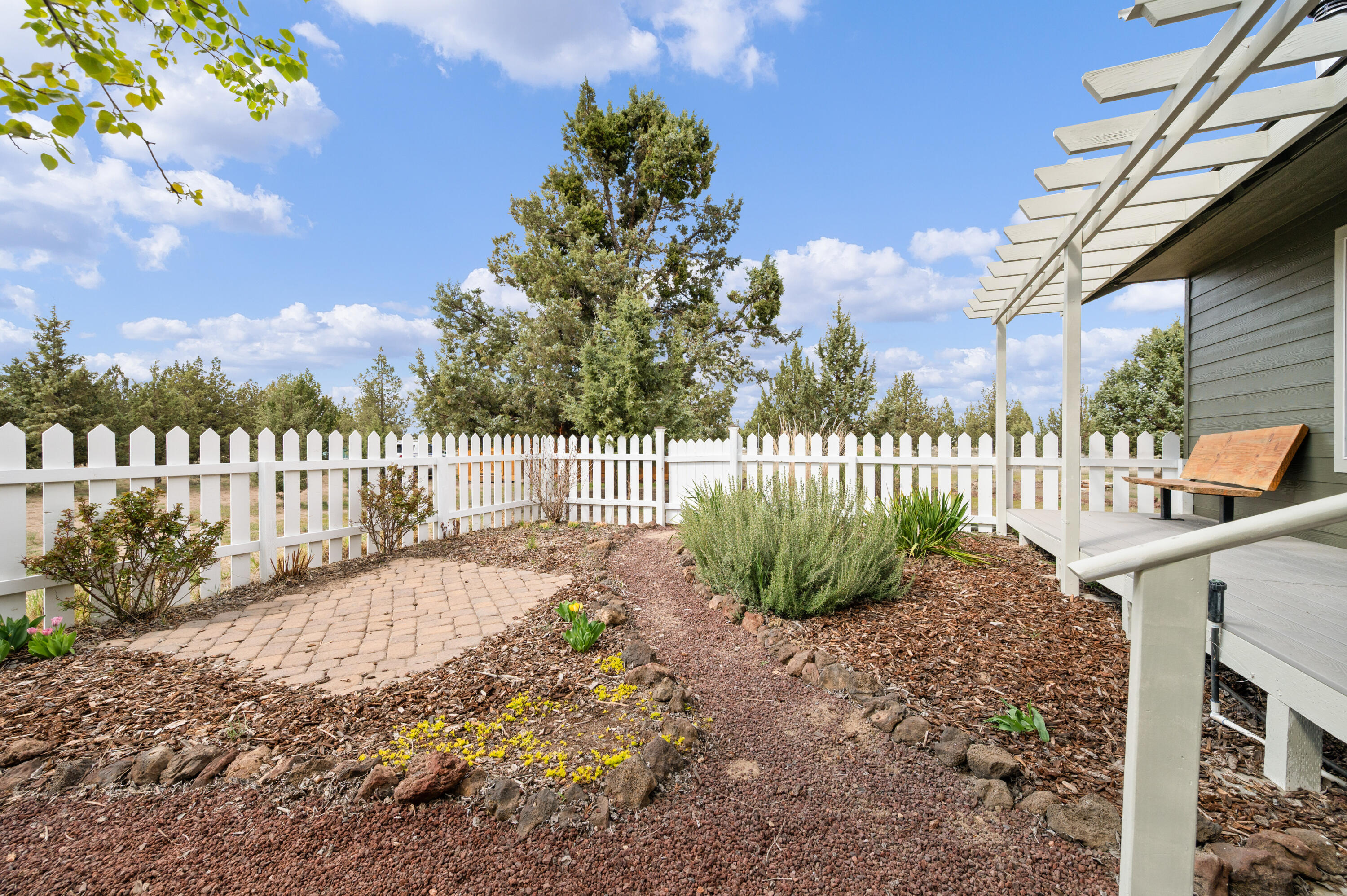 16625 Southwest Dove Road Terrebonne, OR 97760 - Photo 8 of 50 a view of a garden with a flower garden