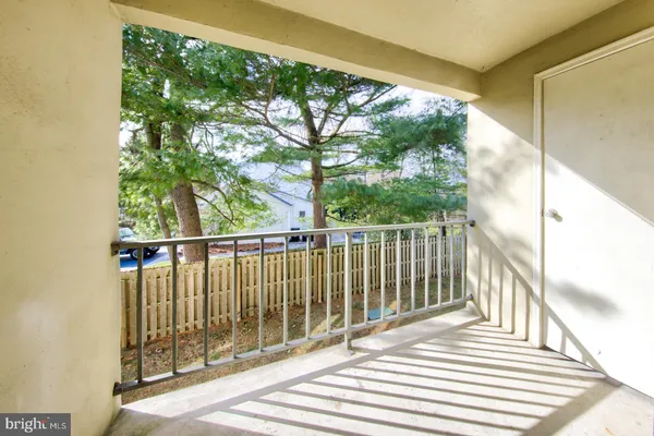 a view of a balcony with wooden floor