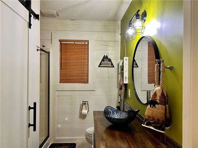 a view of a bathroom with a tub and mirror
