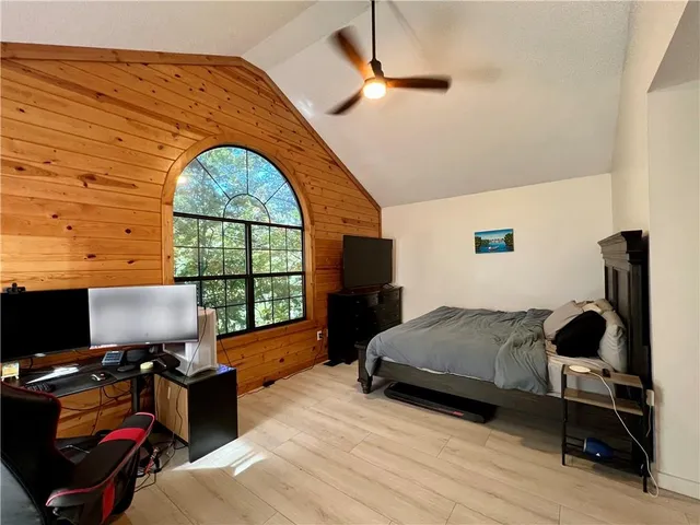 a bedroom with furniture window and a desk