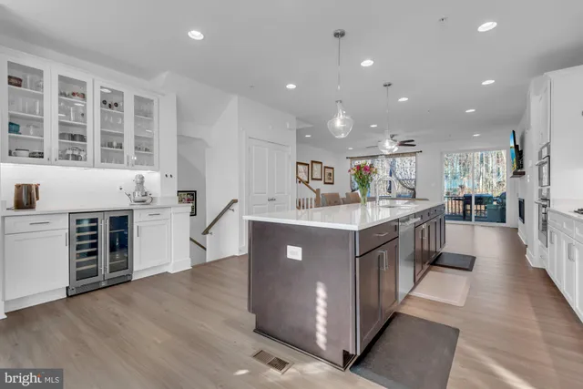 a kitchen with stainless steel appliances granite countertop a stove and a refrigerator
