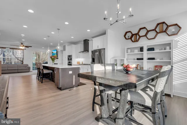 a kitchen with stainless steel appliances granite countertop a stove and a sink