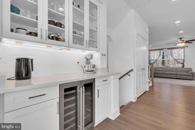 a kitchen with stainless steel appliances granite countertop a refrigerator a stove a sink and a oven