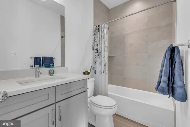 a view of a living room with furniture and a flat screen tv