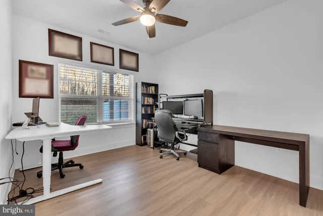 a front view of a building with a yard table and chairs