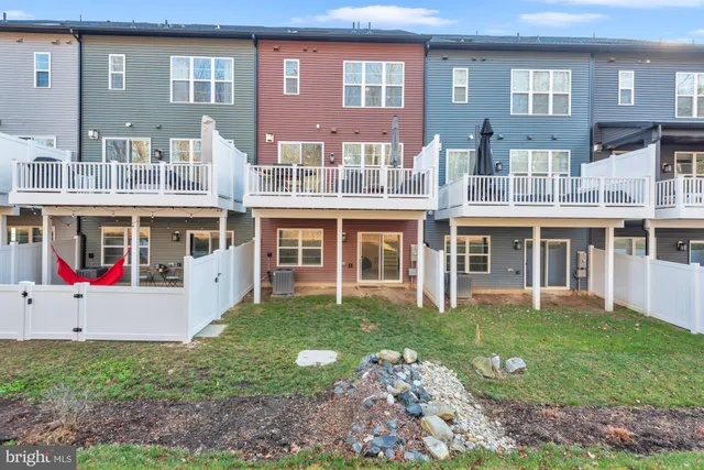 a view of a patio with table and chairs