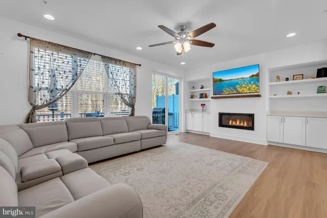 a view of a dining room with furniture and a chandelier