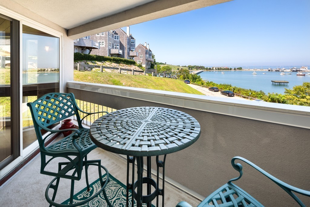 1 Commodore Court, Unit 405 Hull, MA 02045 - Photo 1 of 26 a view of a swimming pool from a balcony