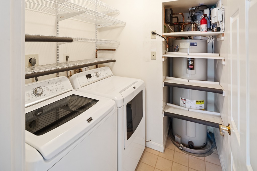 1 Commodore Court, Unit 405 Hull, MA 02045 - Photo 15 of 26 a utility room with dryer and washer