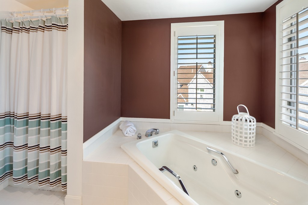 1 Commodore Court, Unit 405 Hull, MA 02045 - Photo 21 of 26 a bathroom with a tub and a window