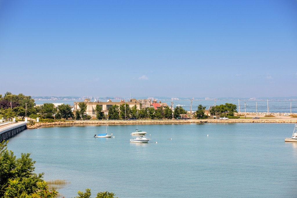 1 Commodore Court, Unit 405 Hull, MA 02045 - Photo 25 of 26 an aerial view of a houses with ocean view
