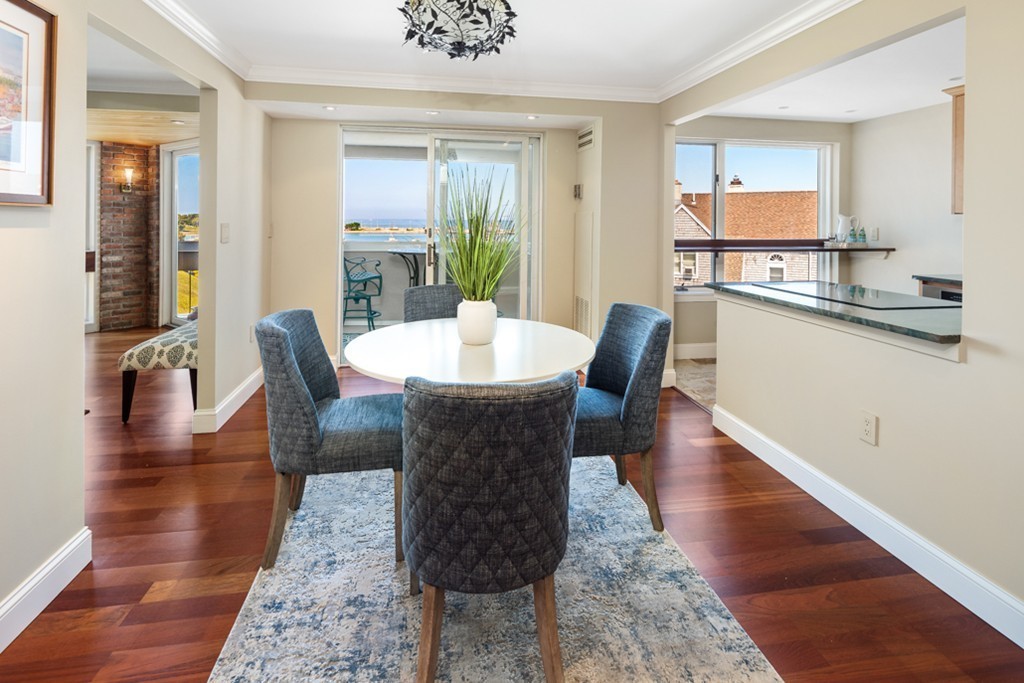 1 Commodore Court, Unit 405 Hull, MA 02045 - Photo 7 of 26 a view of a dining room with furniture
