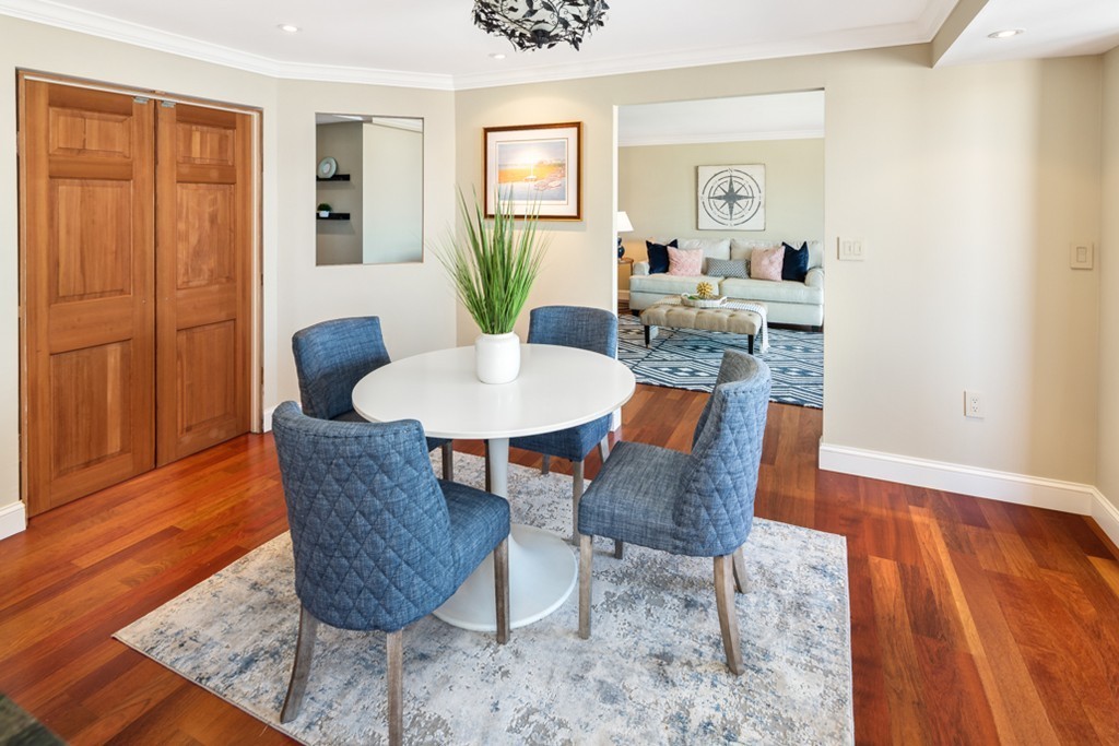 1 Commodore Court, Unit 405 Hull, MA 02045 - Photo 9 of 26 a view of a dining room with furniture