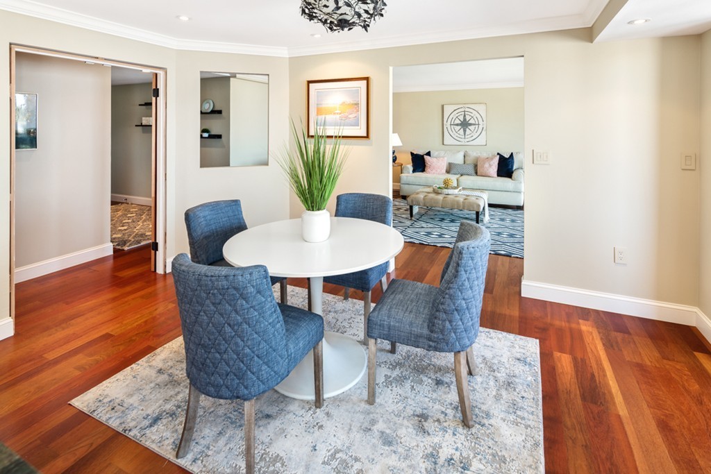 1 Commodore Court, Unit 405 Hull, MA 02045 - Photo 10 of 26 a view of a dining room with furniture