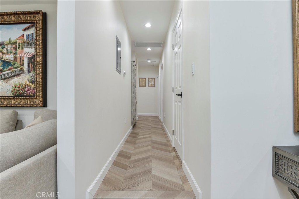 9728 Rhea Avenue Northridge, CA 91324 - Photo 18 of 36 a view of a hallway with wooden floor