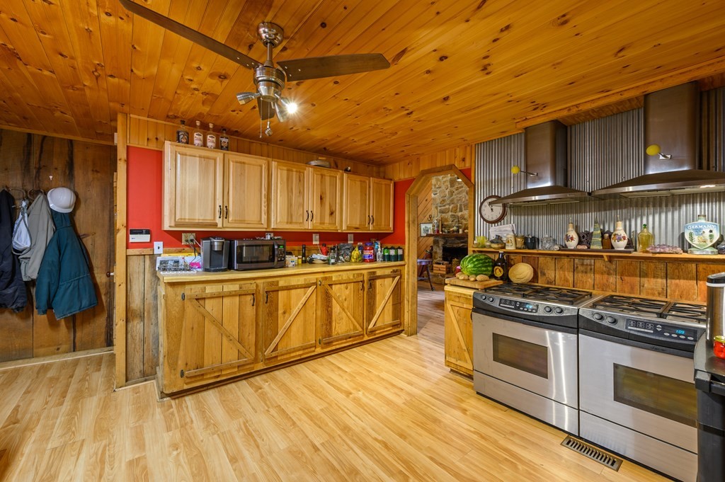 7818 Berry Williams Road Townsend, TN 37882 - Photo 27 of 34 a kitchen with stainless steel appliances granite countertop a stove and a refrigerator