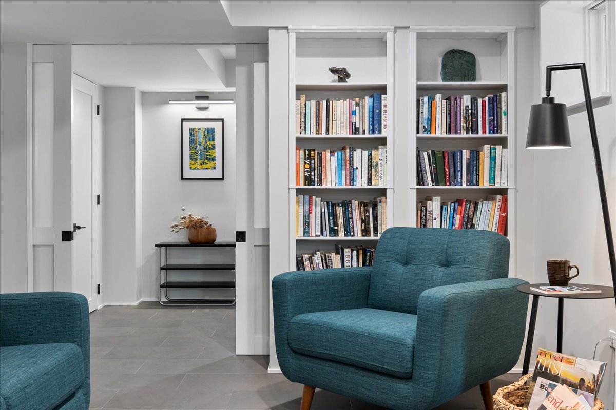 159 West Burton Place, Unit G Chicago, IL 60610 - Photo 12 of 37 a living room with furniture and a book shelf