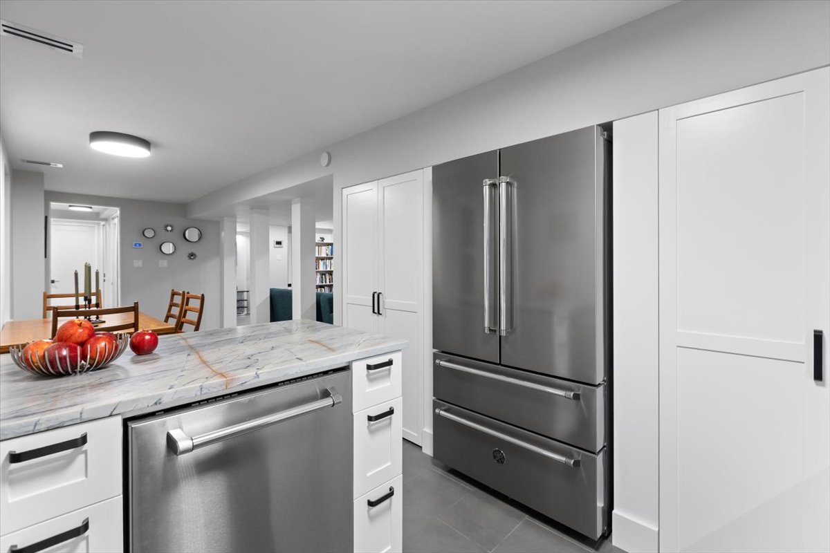 159 West Burton Place, Unit G Chicago, IL 60610 - Photo 19 of 37 a kitchen with stainless steel appliances granite countertop a refrigerator and a sink