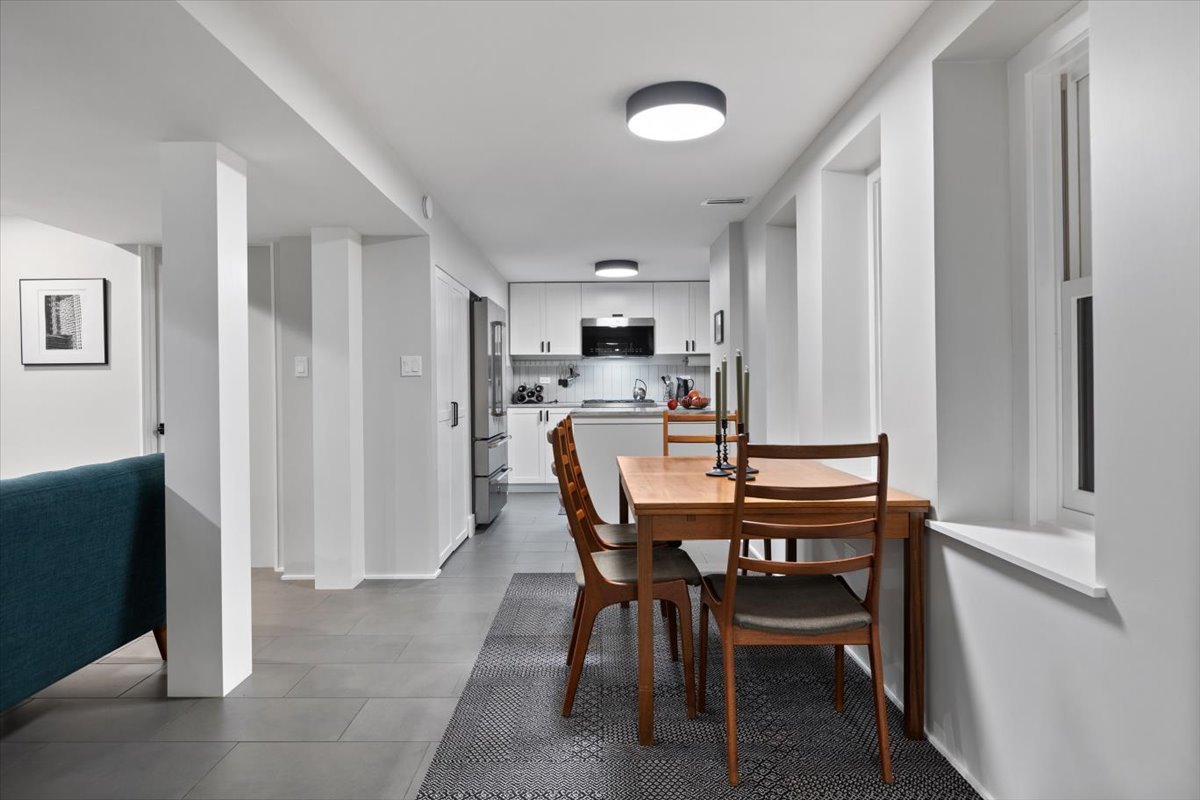 159 West Burton Place, Unit G Chicago, IL 60610 - Photo 22 of 37 a dining room with furniture and window