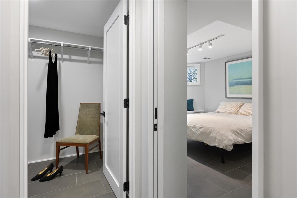 159 West Burton Place, Unit G Chicago, IL 60610 - Photo 33 of 37 a bedroom with a bed and a table