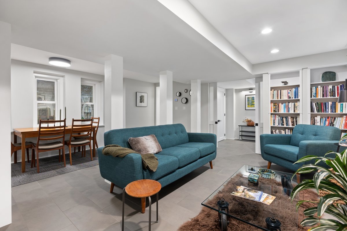 159 West Burton Place, Unit G Chicago, IL 60610 - Photo 7 of 37 a living room with furniture and a book shelf