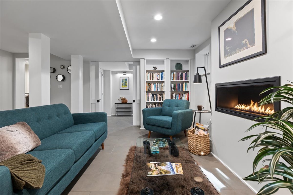 159 West Burton Place, Unit G Chicago, IL 60610 - Photo 10 of 37 a living room with furniture or couch and a bookshelf