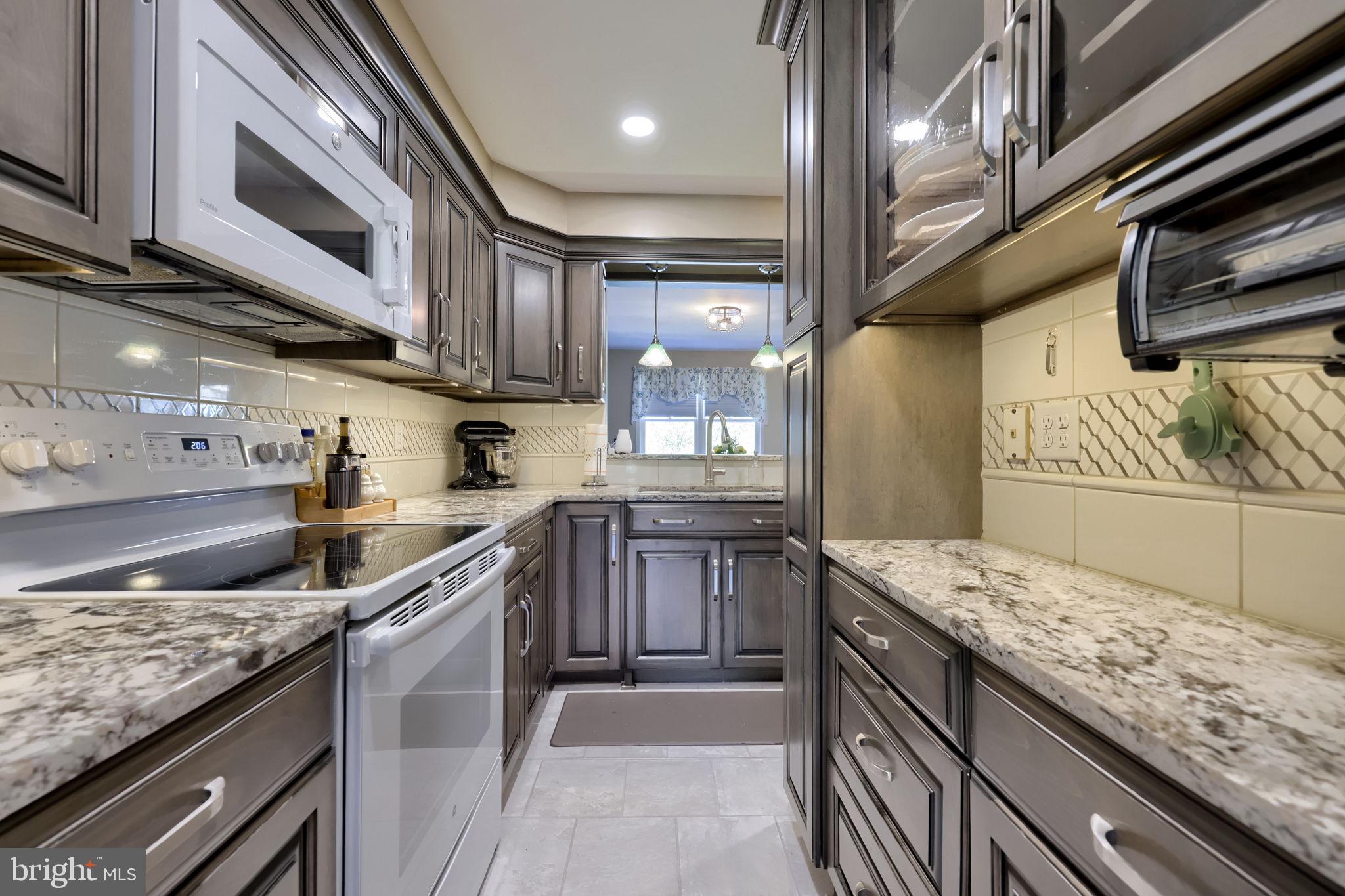 85 Rockford Road Mountville, PA 17554 - Photo 2 of 38 Kitchen with custom cabinetry and granite counters