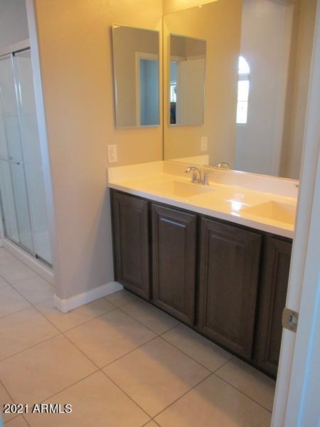 1367 South Country Club Drive, Unit 1153 Mesa, AZ 85210 - Photo 16 of 48 a bathroom with a sink and a mirror