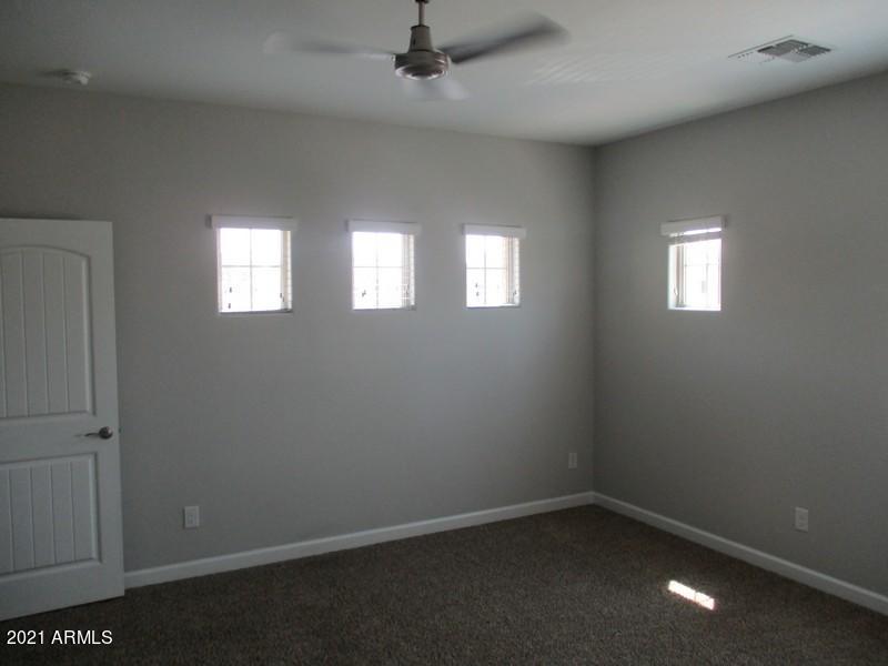 1367 South Country Club Drive, Unit 1153 Mesa, AZ 85210 - Photo 17 of 48 an empty room with windows