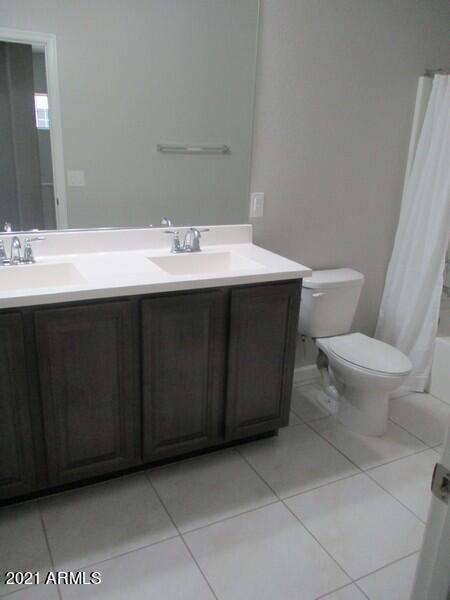 1367 South Country Club Drive, Unit 1153 Mesa, AZ 85210 - Photo 22 of 48 a bathroom with a sink vanity and a toilet