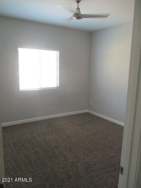 1367 South Country Club Drive, Unit 1153 Mesa, AZ 85210 - Photo 24 of 48 an empty room with a window