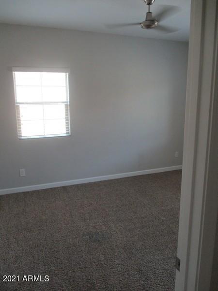 1367 South Country Club Drive, Unit 1153 Mesa, AZ 85210 - Photo 25 of 48 an empty room with a window