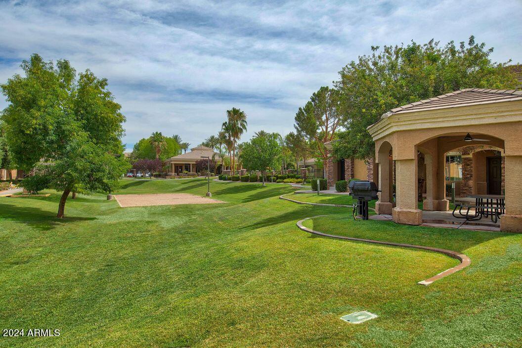 1367 South Country Club Drive, Unit 1153 Mesa, AZ 85210 - Photo 27 of 48 a view of a fountain in front of a house with a big yard